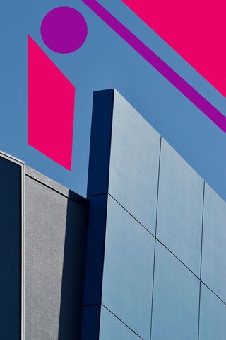 grey building with blue sky with added colourful, shapes and lines 