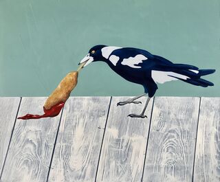 Australian magpie dragging a Dagwood dog with tomato sauce along a white wooden table.