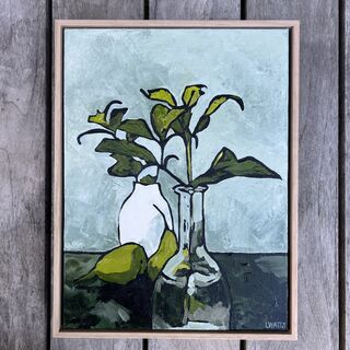 Two pears nestle between two vases, each holding branches with green leaves. 