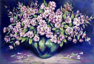 A blue and green vase full of white apple blossoms with dark blue background.