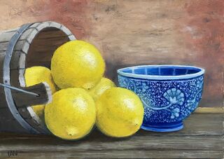 Lemons, blue bowl, wooden bucket on kitchen bench