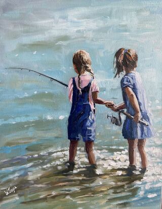 Two young girls stand knee deep in a sparkling ocean sharing a fishing rod.