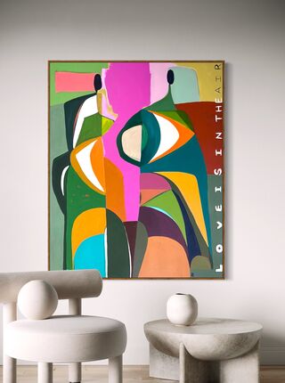 Two abstract figures in shapes of green, white, orange, blue, yellow, pink, with writing down the side.