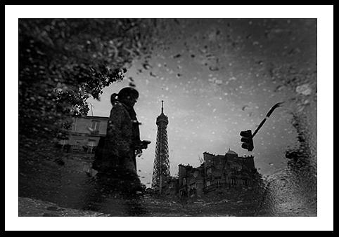 Black and white reflection in puddle in Paris