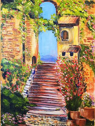 Stairs between two Mediterranean style buildings. Multi colour flowers on the stairs. 