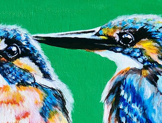 Two kingfishers hunting for food captured on the lookout.