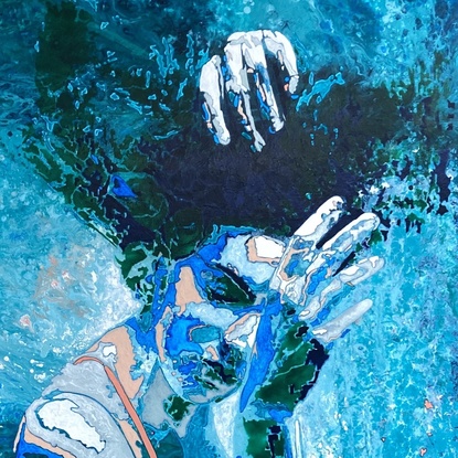 Woman floating underwater with reflections.