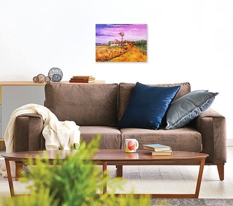 Australian outback house with red roof. Dry yellow grass all around it. A windmill next to it. Pink sky. Hills in the background. 