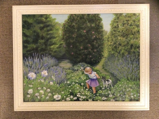 Child and dog in flower garden