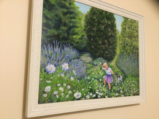 Child and dog in flower garden