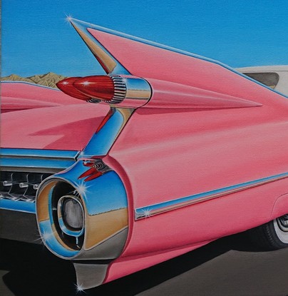 Pink 59 Cadillac driving to fill up at Retro Service station in Palm Springs California 