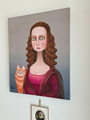 Surrealistic portrait of young  woman (Mona Lisa ) with cat 