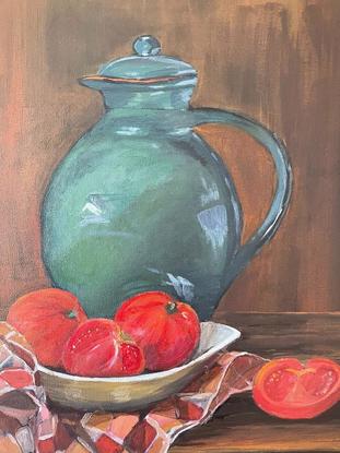 Still life painting of a green jug and a bowl of ripe tomatoes sitting on a tea towel, placed on an old wooden table. The painting tries to capture a rustic background with a knotted drapes hanging by the side.