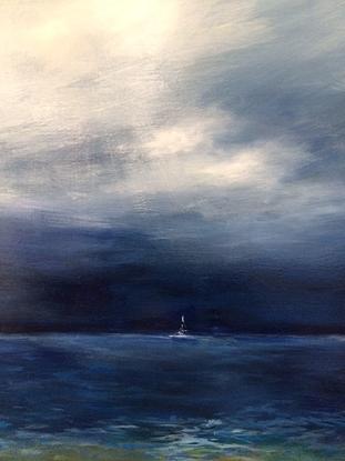 Large stormy clouds over a dark ocean dark nave blue white clouds white boat