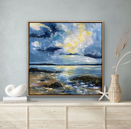 A brightly lit cloud in the midst of simmering angry clouds above the rocky shoreline. Hints of mauve and soft buttery lemon on the beach and waves. This painting is all about the drama and light in the sky above the waves and the rocky shoreline. The blues used in this work are moody and mirror the power of the approaching storm. 

The frame posted this beautifully as it mirrors the soft sand colours of the beach. A signature piece to add drama and style to your room. 