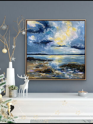 A brightly lit cloud in the midst of simmering angry clouds above the rocky shoreline. Hints of mauve and soft buttery lemon on the beach and waves. This painting is all about the drama and light in the sky above the waves and the rocky shoreline. The blues used in this work are moody and mirror the power of the approaching storm. 

The frame posted this beautifully as it mirrors the soft sand colours of the beach. A signature piece to add drama and style to your room. 