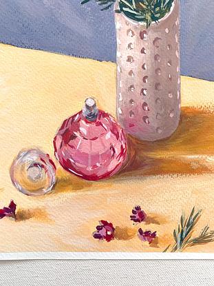 Little flowers in vase with pink perfume bottle