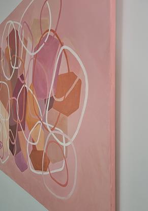 Layered organic shapes, solid shapes at the back with unfilled shapes on topic, in shades of pink, blush, rose, orange and apricot over a light pink background.