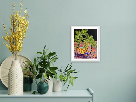 A small bright watercolour of lime green Lily leaves in a red spotted teacup on a flowered tablecloth