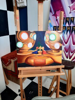 Cropped painting of a metallic party light focusing on dancing figurines