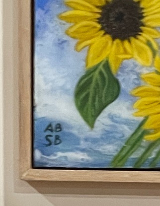 Sunflowers on a sky blue background in a floating Tassie oak frame.