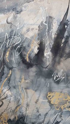 A large abstract painting showing  landscape in shades of cream, brown, black and dark blue.