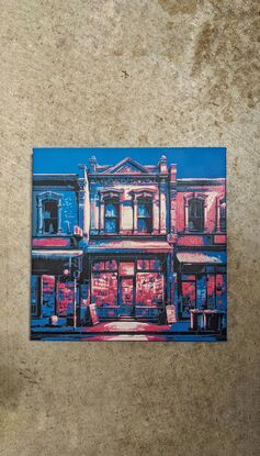 A blue and neon stencil art painting depicting a Melbourne City shopfront at night.