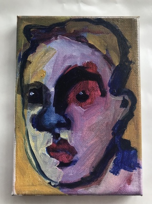 Small canvas with a painting of a man’s head with blank eyes. 