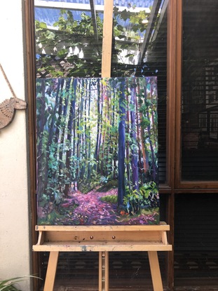 Forest landscape with tall trees, and two people walking.  Colours of green, pink, purple and yellow.