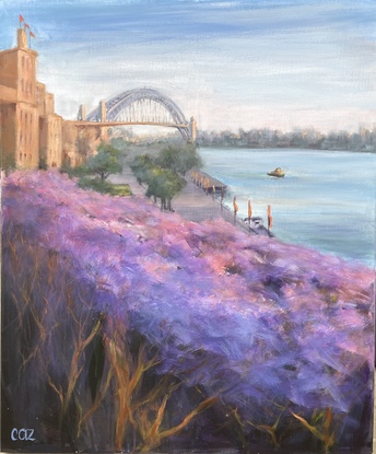 Sandstone glows warmly in the summer sun, drenching the harbour and a riot of jacarandas in summer sun