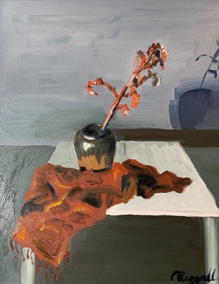 Red tendril in ochre vase on white table with a red cloth and a grey background 