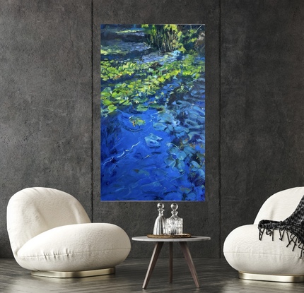 This is a tall vertical  ( golden mean proportion)  oil painting of  a water lilies growing in a pond.   It is a bright day with the bright blue sky reflecting on the water.  We can see deep into the foreground water  to the weeds and  purple shadows below.   On the surface the light dances across the green lily pads,  highlighting the green pads and orange leaves that have fallen from above to take us across to other side.