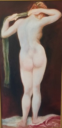 A full length standing female nude from a back view.