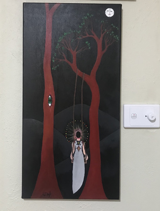 Faceless figure on swing in long red tree at 13 o’clock. Adjacent tree has unsettling eye and the moon tells the time and has a face.