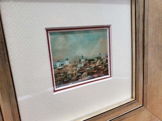 Miniature cityscape of Rome by Victoria Collins in terracotta and peach tones, focused on city skyline with statues of angels on duomo roofs. 