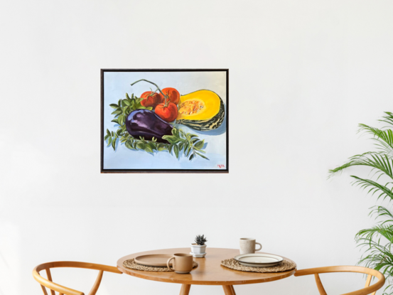 An aubergine,  three tomatoes and a section of pumpkin lying on a bed of basil leaves