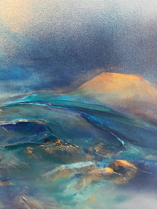 An atmospheric mountain and skies landscape painted in many shades of blue, highlighted in metallic soft gold and copper notes. It depicts the blue rolling mist over deep blue mountain ranges which meet the sky above