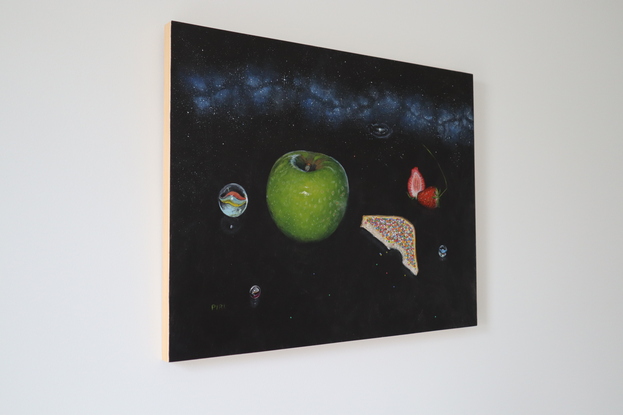 Painting of black night sky with band of the milky way in the upper third of the painting. In the foreground are cat eye marbles, a green granny smith apple, fairy bread with a bite taken out of it, a strawberry cut in half and another whole strawberry.