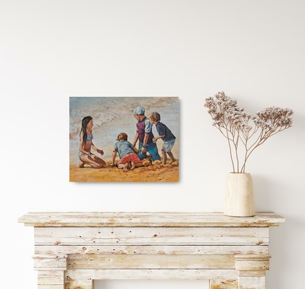 Family of children, brothers and sister, digging in the sand at the beach