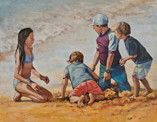 Family of children, brothers and sister, digging in the sand at the beach