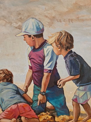 Family of children, brothers and sister, digging in the sand at the beach