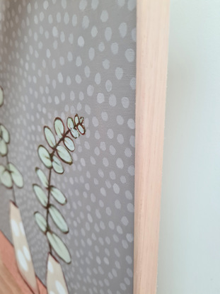 two silver dollar eucalyptus plants in vases