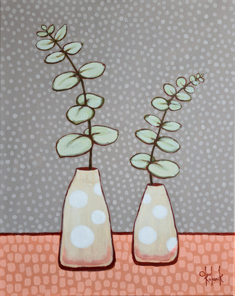 two silver dollar eucalyptus plants in vases