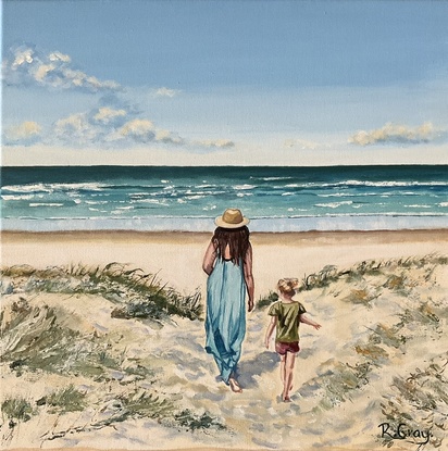 Woman and child walking through dunes to beach