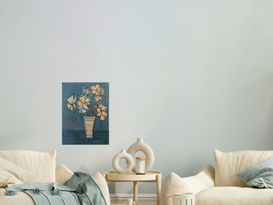 A still life of geometric cream coloured flowers, sitting in a decorative vase, blue background.