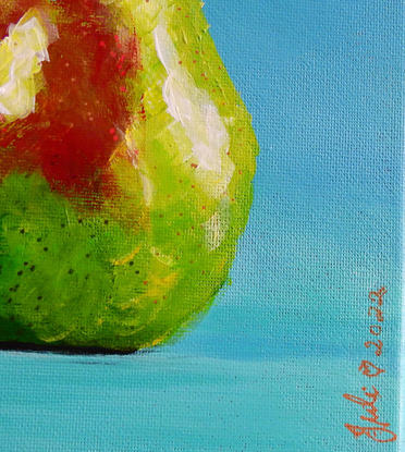 Green pear on blue/green background