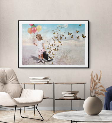 A little girl releases a suitcase full of butterflies into the wild blue yonder.