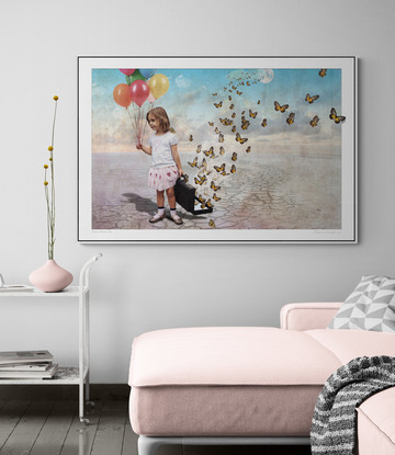 A little girl releases a suitcase full of butterflies into the wild blue yonder.