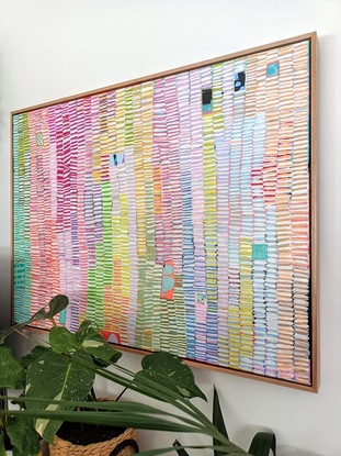 a colourful striped artwork full of lots of colourful marks in columns.