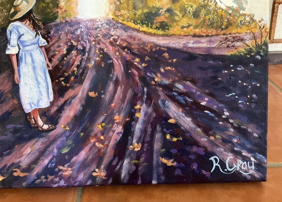 Autumn scene with woman walking along road 